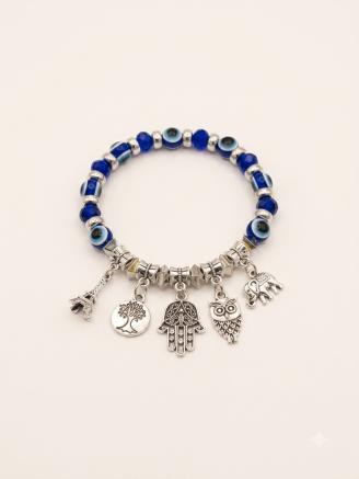 Handmade blue evil eye bracelet featuring Hamsa hand, owl, elephant, tree of life, and Eiffel Tower charms.