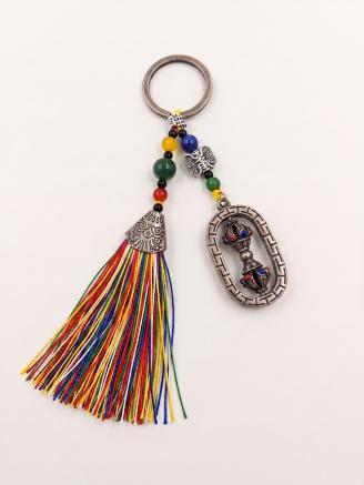 Handmade Tibetan Dorje Vajra tassel keychain with multicolor rainbow tassel and decorative beads.